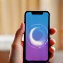 Smartphone screen displaying a breathing exercise app with calming animations.