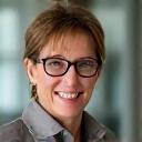 Portrait of a smiling woman, Sarah J., 48, vibrant and healthy.